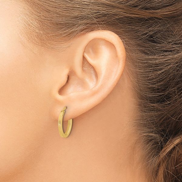 Leslie's 10K Polished and Textured Oval Hoop Earrings Image 3 Selman's Jewelers-Gemologist McComb, MS