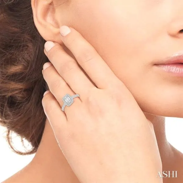 5/8 Ctw Emerald Shape Round Cut and Baguette Diamond Ring...