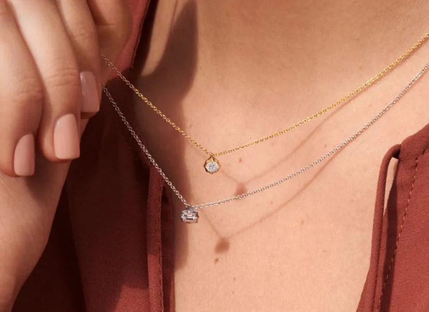 Closeup of two single diamond necklaces from Biondi Jewelers