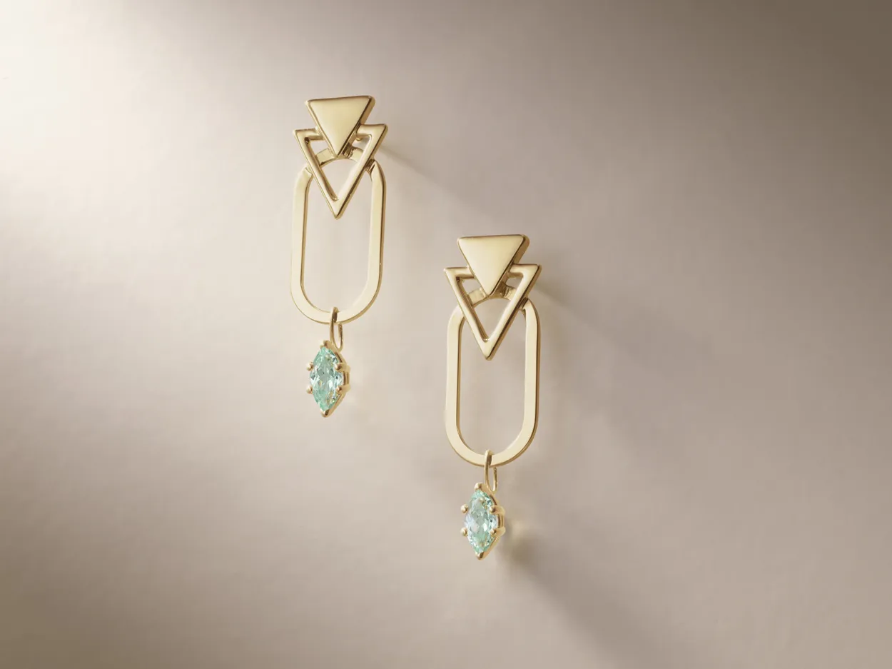 Gold geometric earrings with aqua gemstones, perfect for adding elegance to any outfit. 