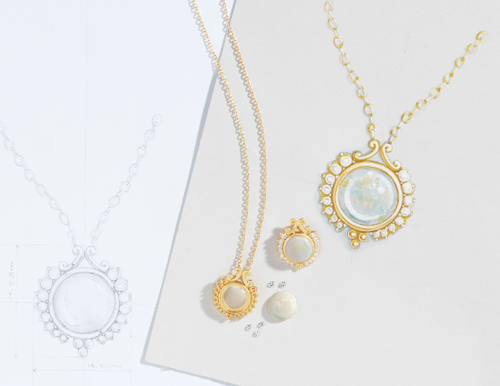 Gold necklaces and earrings with opal stones, alongside a design sketch, showcasing custom jewelry options.