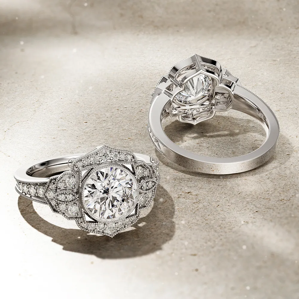 Elegant diamond engagement ring with intricate design, featuring a large center stone and smaller accents.