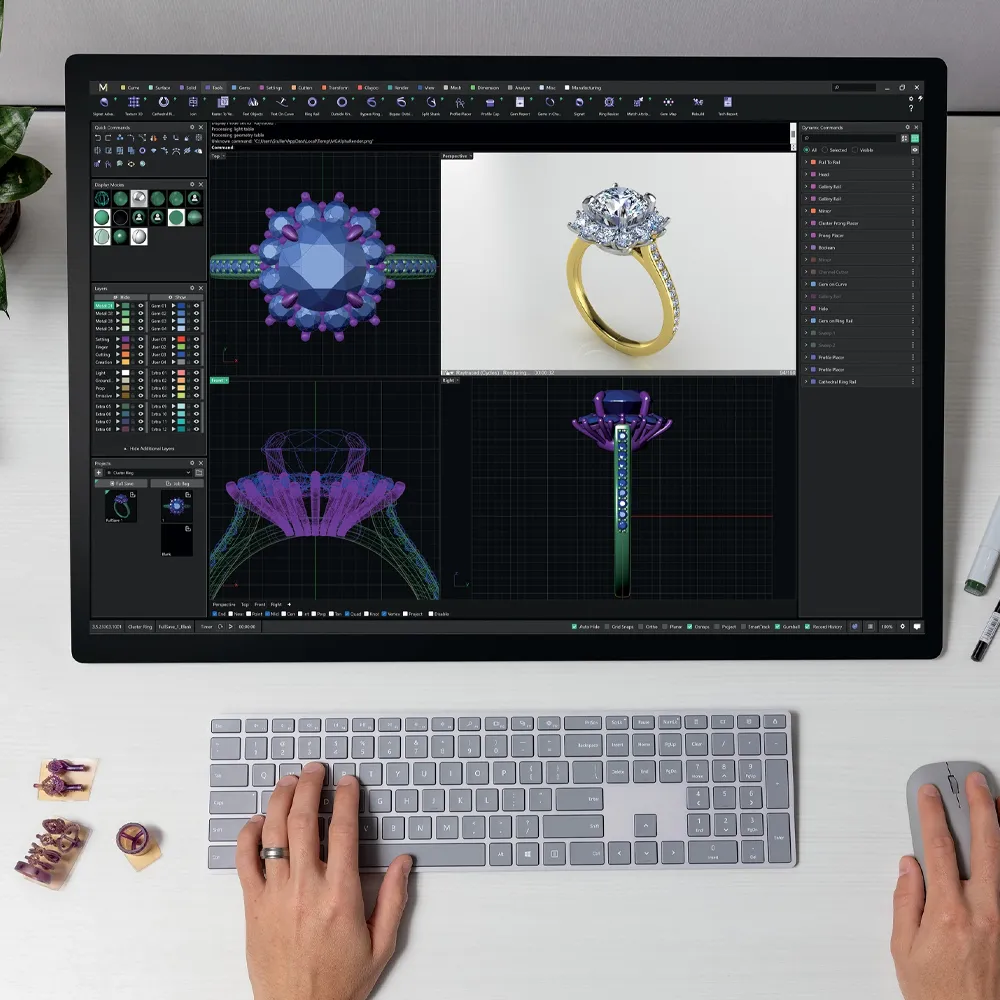 A designer creating 3D jewelry models on a computer, showcasing rings and design tools. Visit Amos Jewelry for custom pieces.