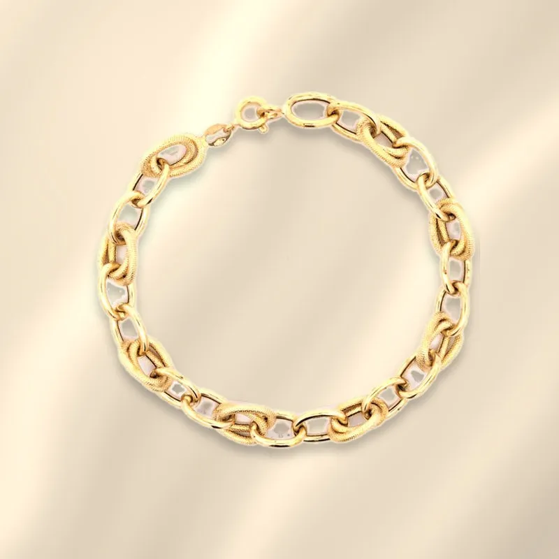 18K yellow gold Italian open link bracelet with polished and diamond-cut links on champagne silk