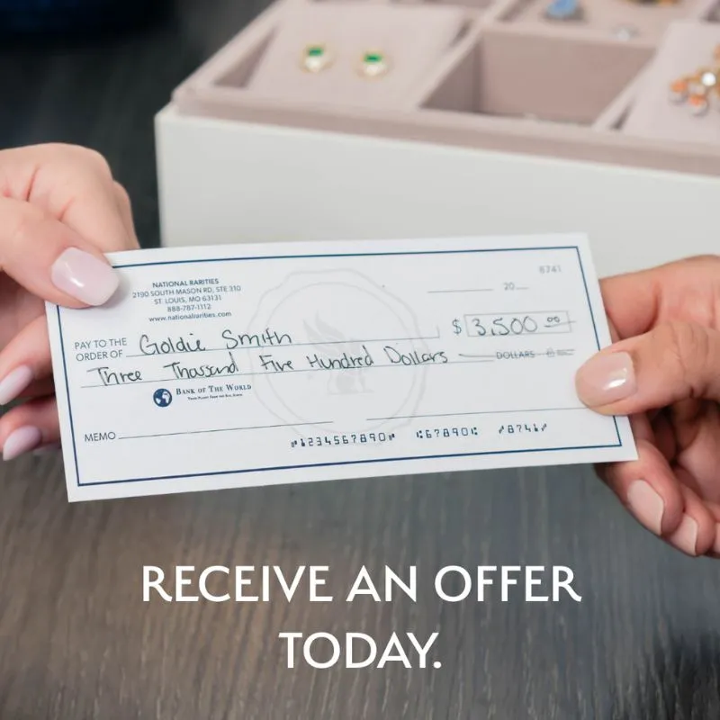 Two hands holding a check for $3,500 with jewelry in the background.