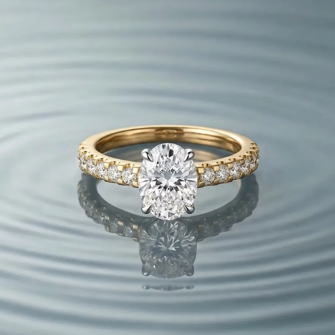A gold engagement ring with a large Centurion oval diamond and smaller diamonds on the band