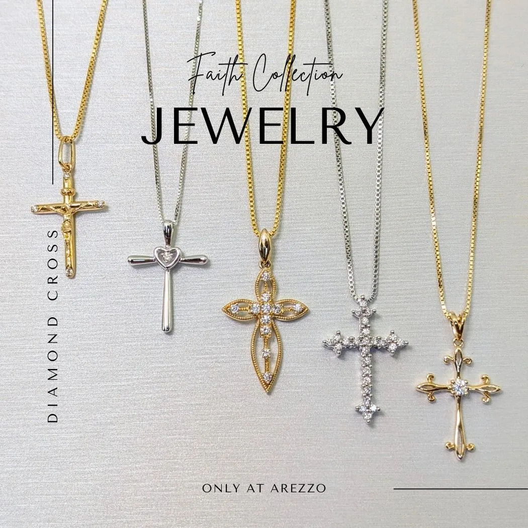 Five cross necklaces in gold and silver displayed on a neutral background at Arezzo Jewelers in Elmwood.
