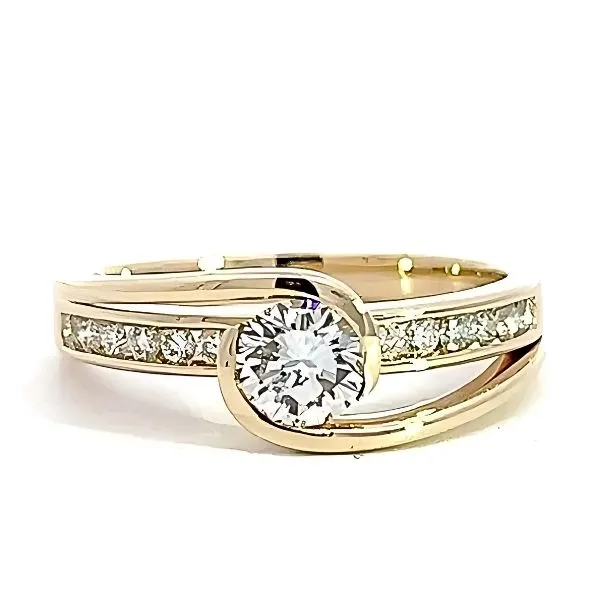 Elegant gold ring with a central diamond and smaller stones, symbolizing eternal love. Explore more at Arezzo Jewelers