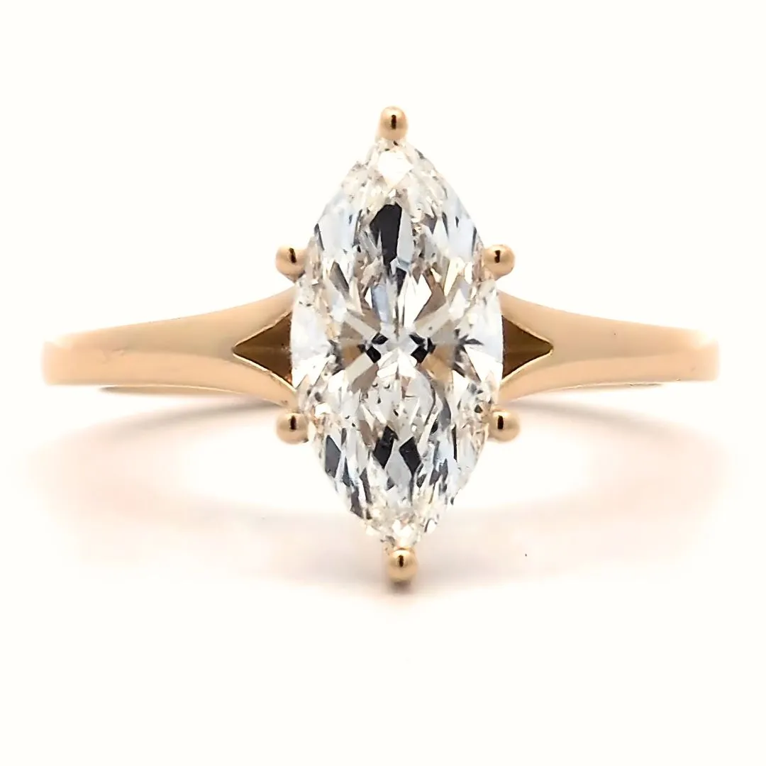 Marquise-cut diamond engagement ring set in rose gold, showcasing elegance and brilliance. Click for engagement rings.