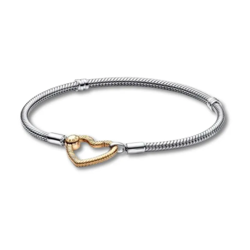 Silver and gold heart charm bracelet from Arezzo Jewelers, perfect for gifting or personal style. Click to shop now!