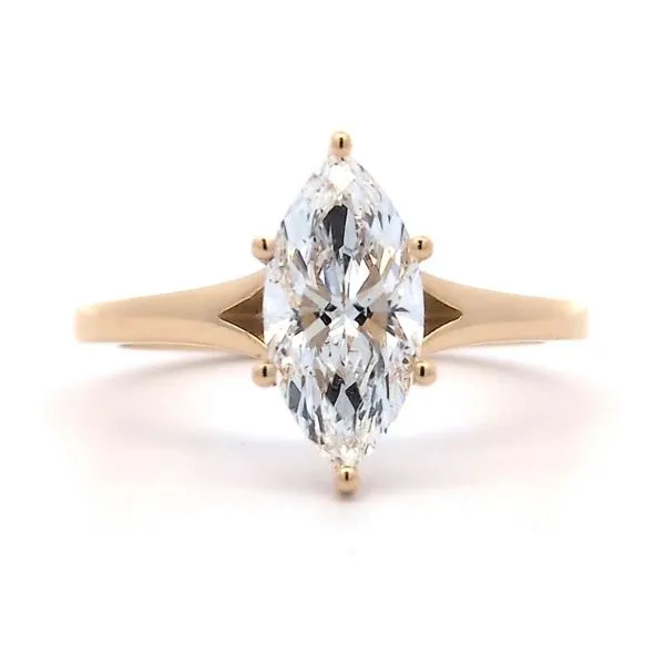 A marquise-cut diamond ring with a gold band.