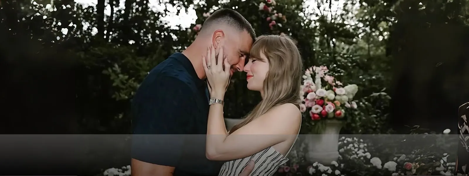 Taylor Swift and Travis Kelce in a garden, inspired by Taylor Swift's engagement rings. Visit Arezzo Jewelers for more.