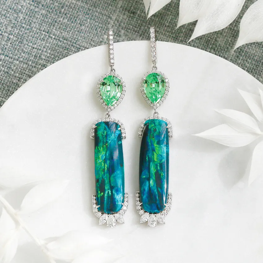 Elegant gemstone earrings featuring vibrant blue and green stones with diamond accents, perfect for any occasion.