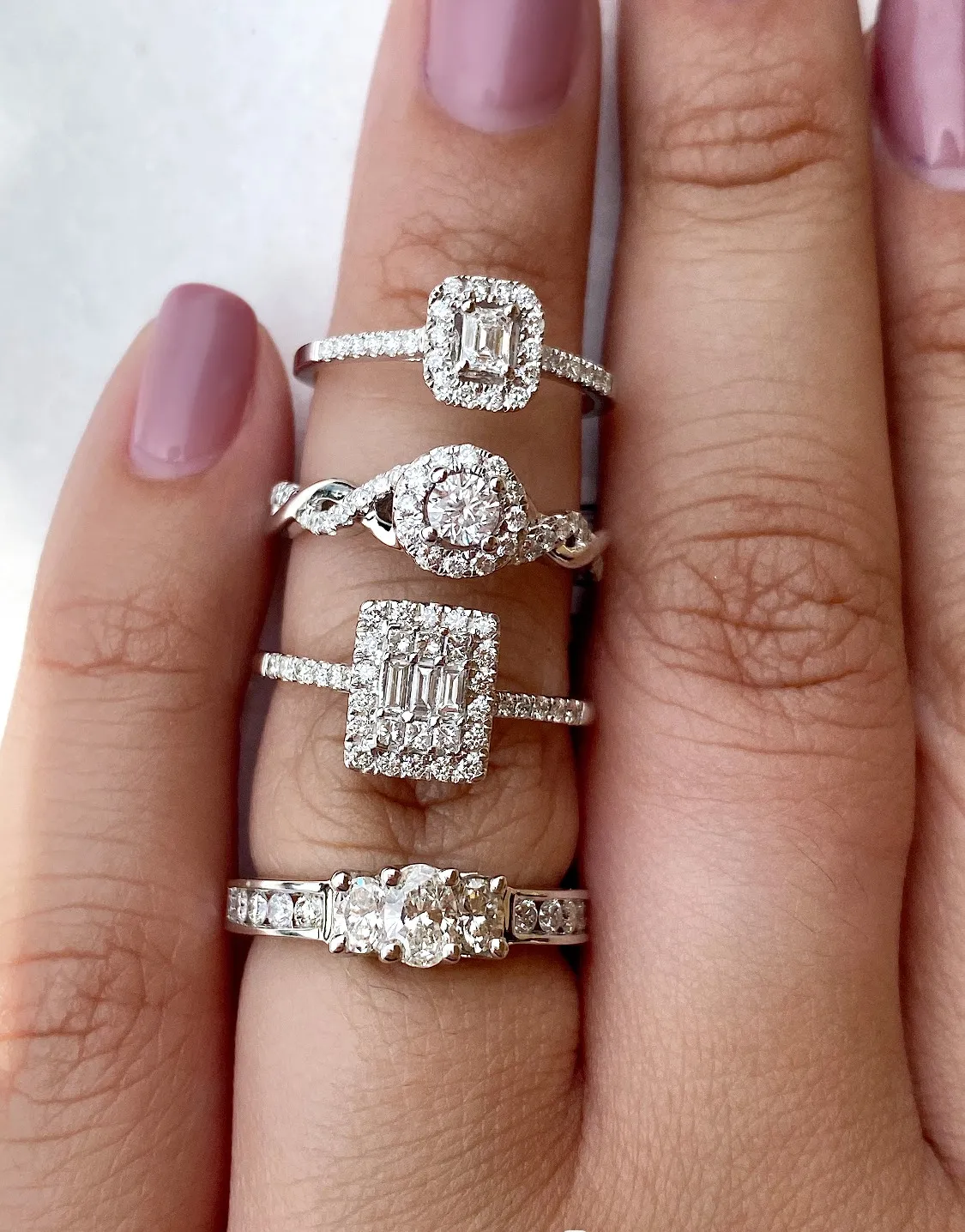 Model Wearing Four Diamond Rings