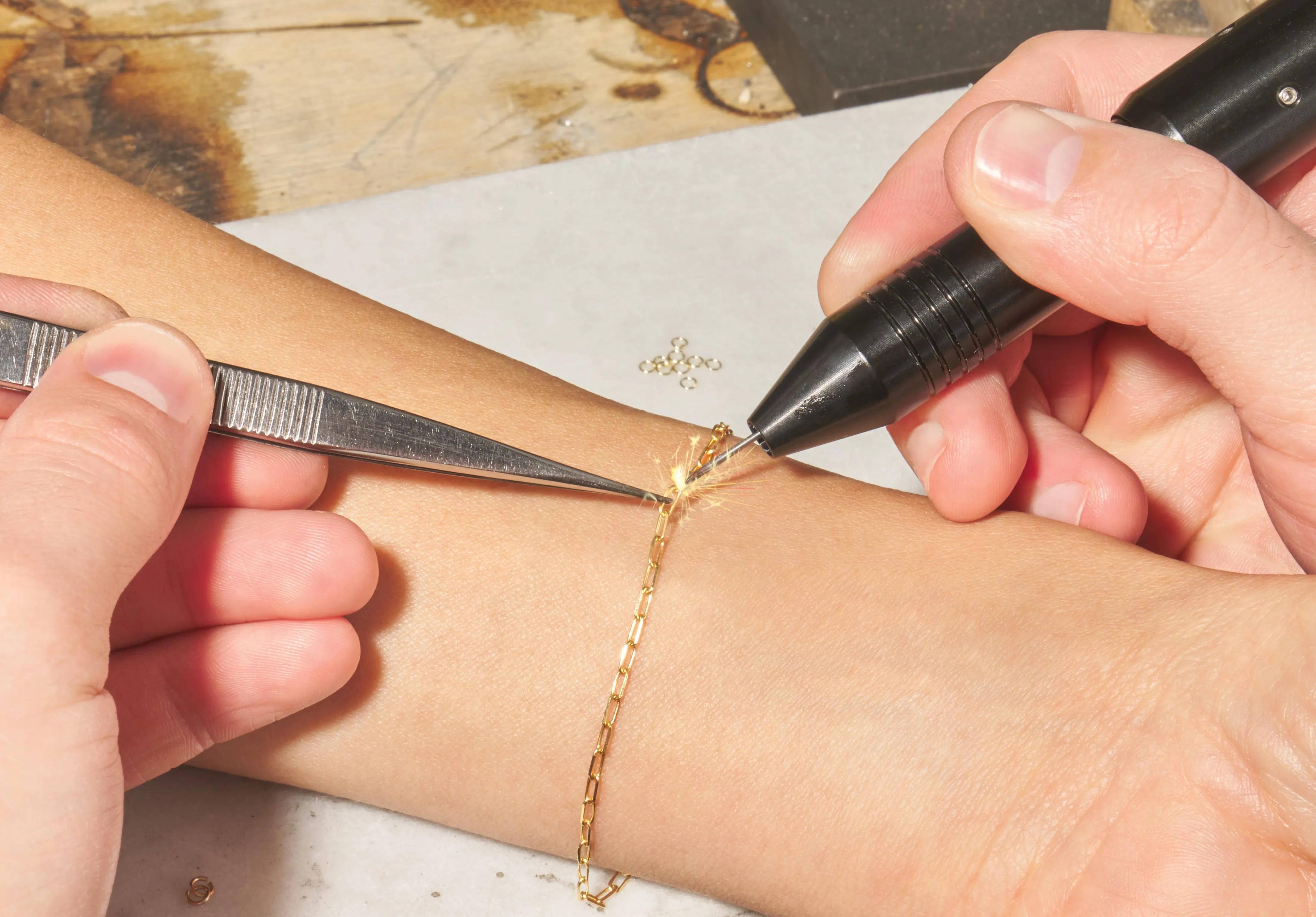 Model Having a Permanent Gold Chain Attached
