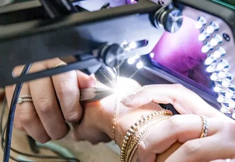 Jeweler Welding a Permanent Bracelet