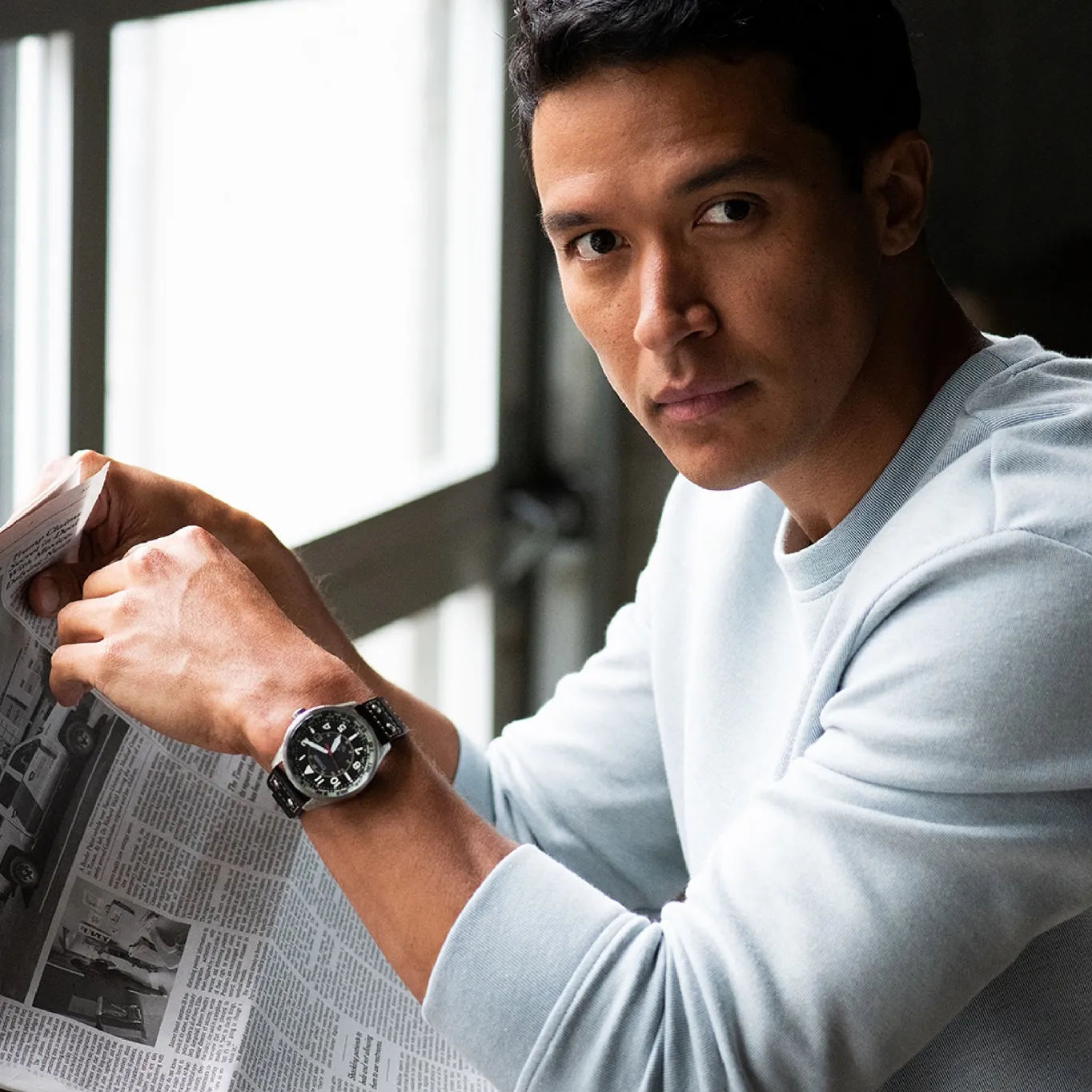 Dad reading the newspaper while wearing his Citizen watch