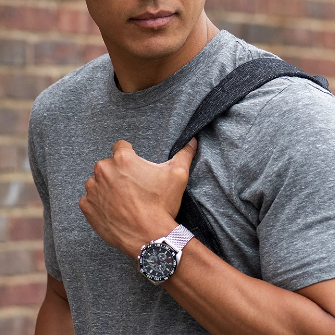 gentleman carrying a backpack while sporting a Citizen watch