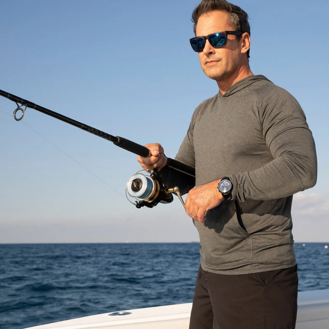 guy fishing wearing a durable Citizen watch