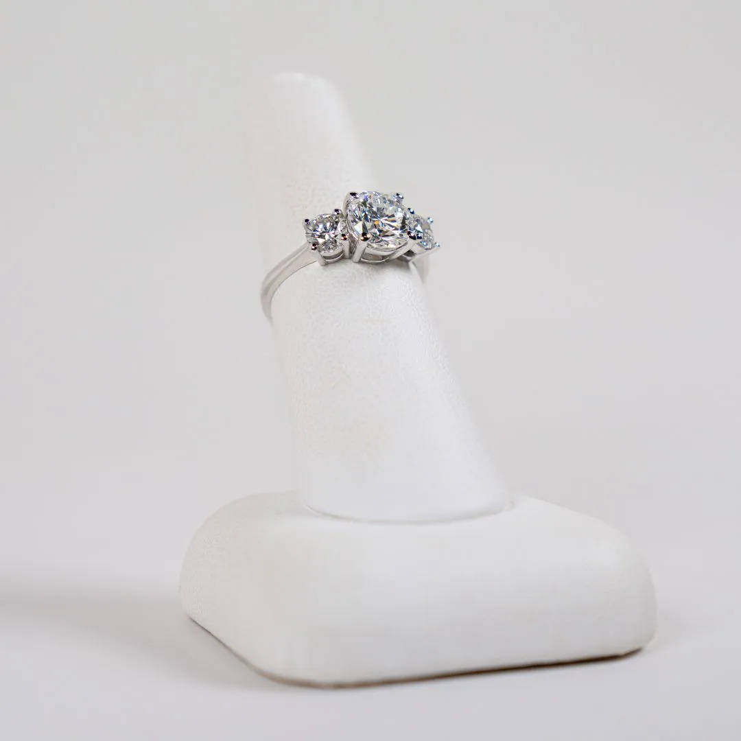  14 Karat White Gold 3 Stone Engagement Ring with a 1.66 Carat Round Brilliant Shaped Center Diamond and 2 Round Accent Diamonds Bay Area Diamond Company Green Bay, WI