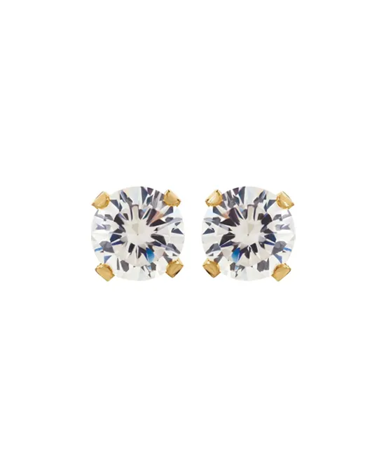 Elegant round diamond stud earrings with gold settings. Visit Bethany's Jewelry in Wellsboro for more details.