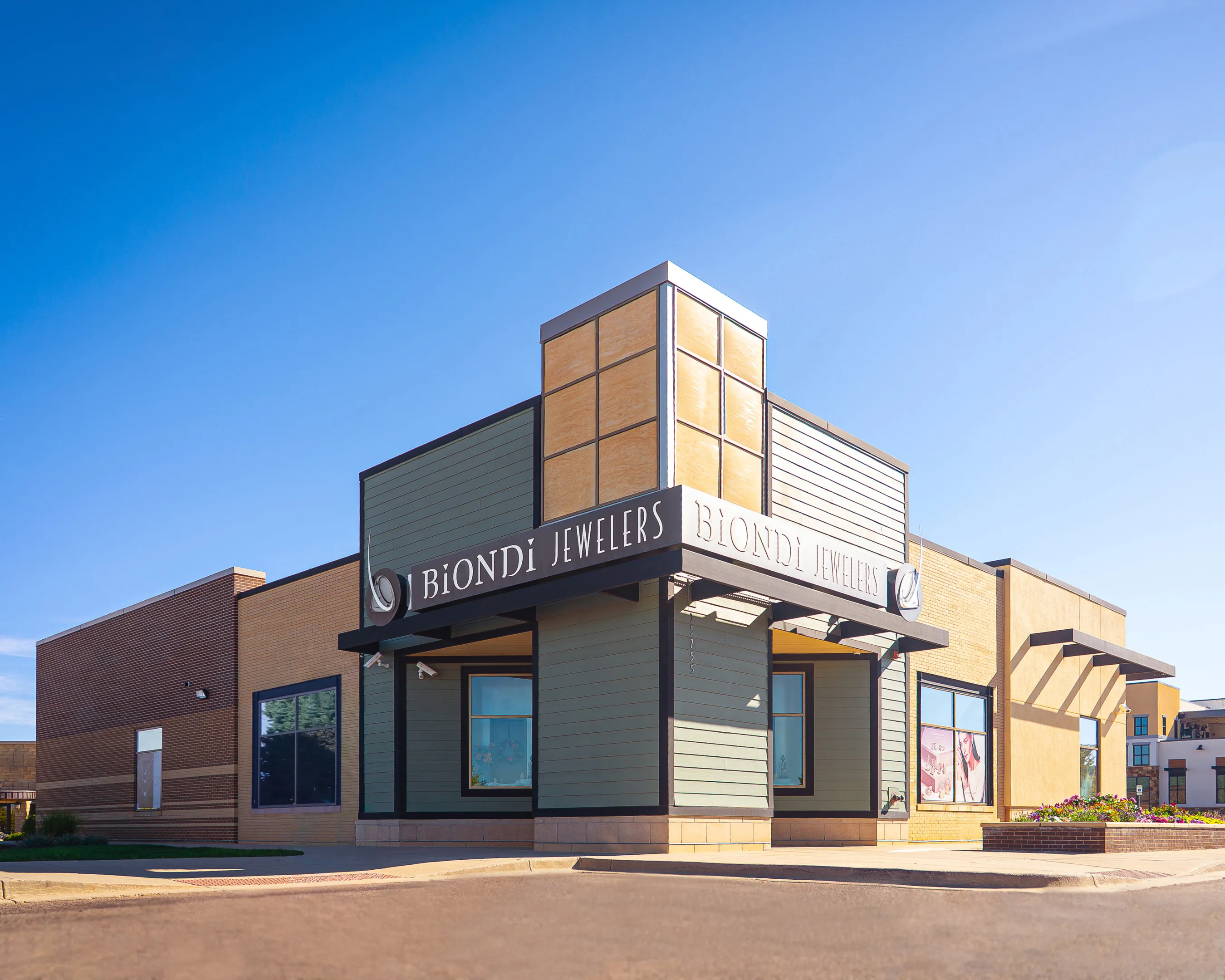 Biondi Jewelers store exterior with signage and accessible parking spaces.