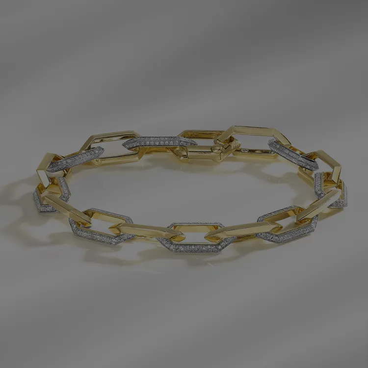 Gold and diamond link bracelet on a neutral background.
