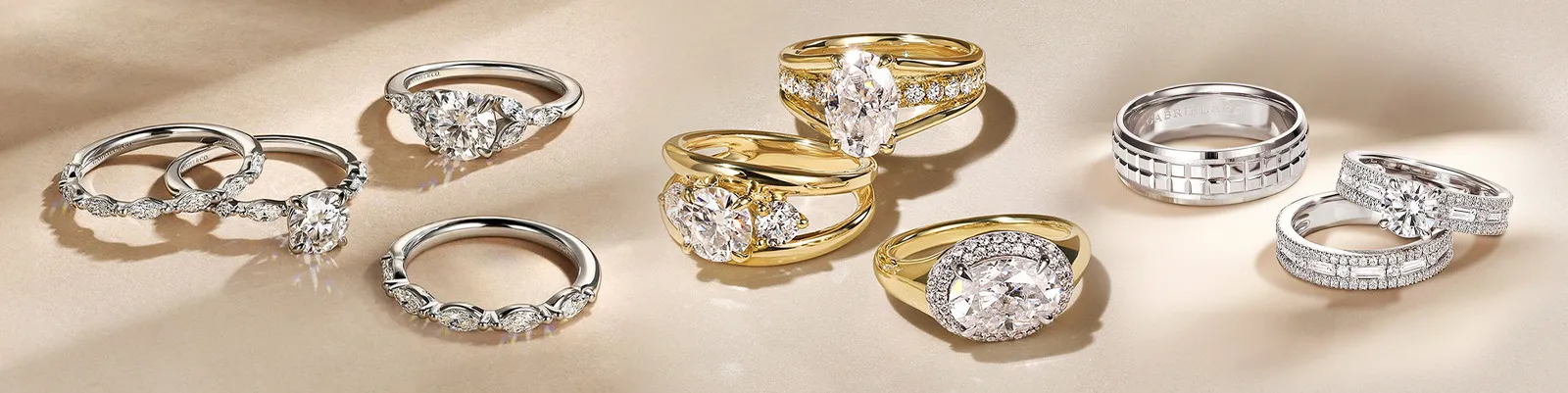 Elegant display of diamond rings in gold and silver settings, showcasing various styles from Brax Jewelers.