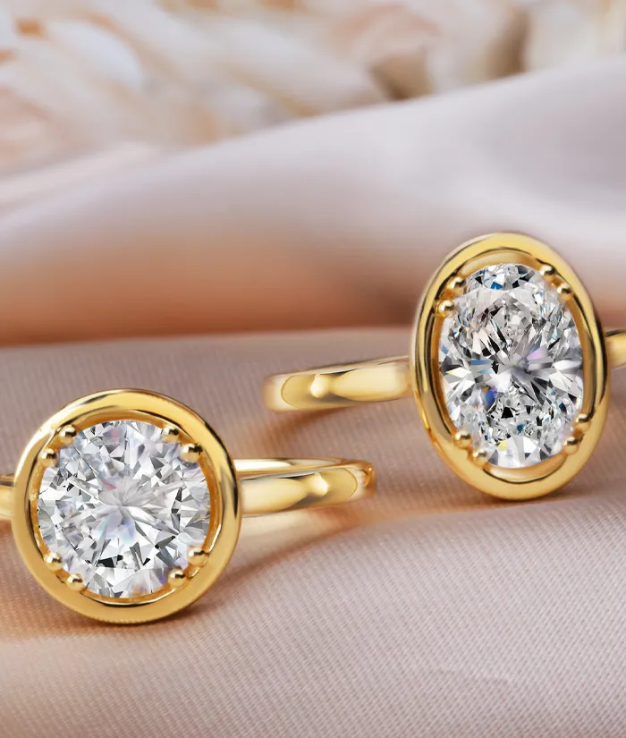 Elegant gold rings featuring large, sparkling diamonds, perfect for engagement or special occasions.