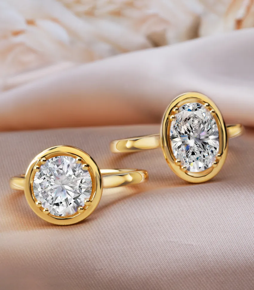 Elegant gold rings featuring large, sparkling diamonds, perfect for engagement or special occasions.