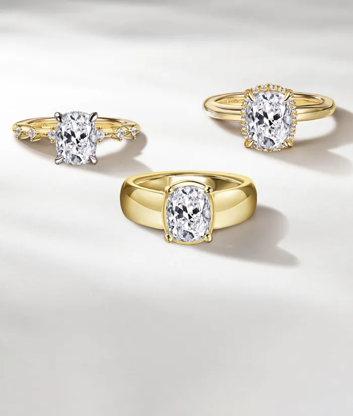 Three elegant gold engagement rings with sparkling diamonds, showcasing various styles. Click to learn about financing options.