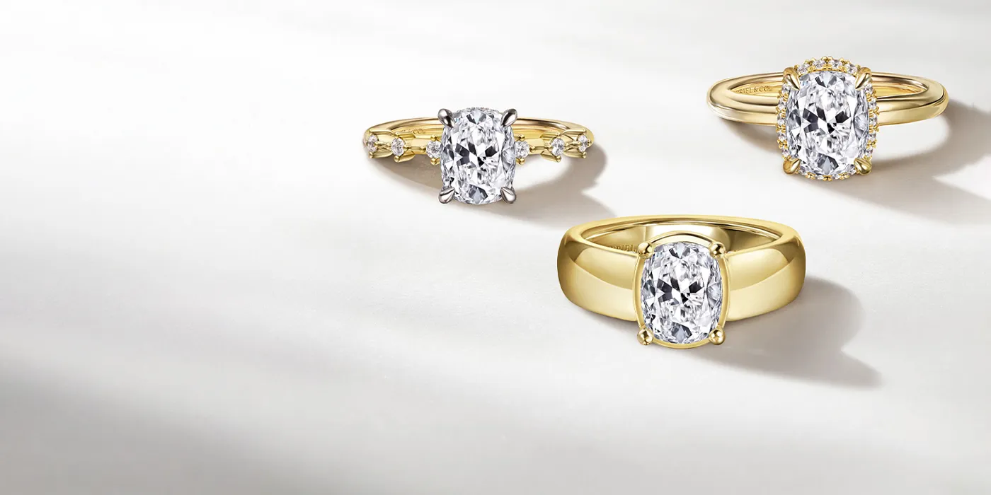 Three elegant gold engagement rings with sparkling diamonds, showcasing various styles. Click to learn about financing options.