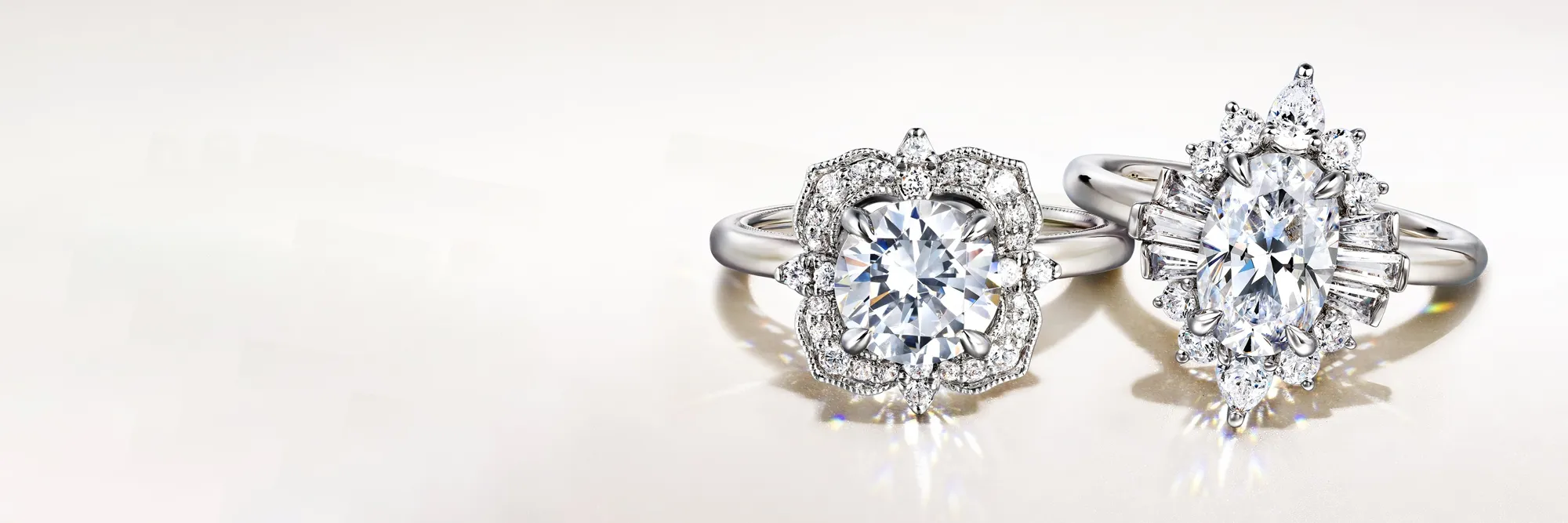 Two elegant diamond engagement rings on a light background. Click to learn more about choosing the right setting at Bryan Jewelr
