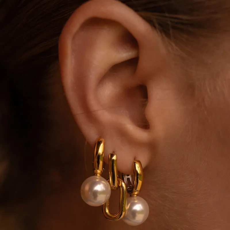 Gold hoop earrings with pearls, showcasing a stylish design. Shop at Bryan Jewelry in Prattville for fine jewelry.