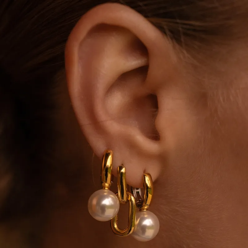 Gold hoop earrings with pearls, showcasing a stylish design. Shop at Bryan Jewelry in Prattville for fine jewelry.