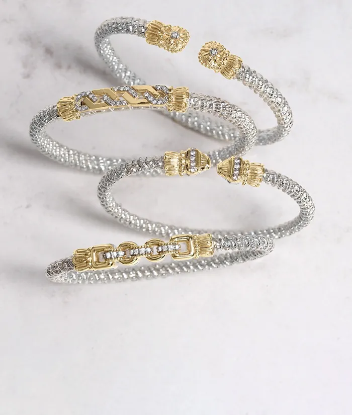 Three elegant bracelets featuring silver and gold designs, showcasing intricate details. Click to shop now at Bryan Jewelry.