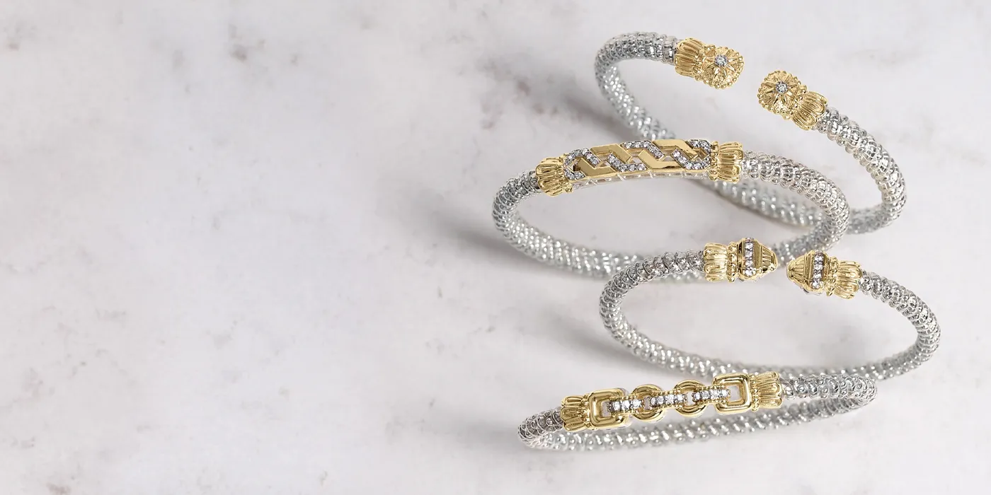 Three elegant bracelets featuring silver and gold designs, showcasing intricate details. Click to shop now at Bryan Jewelry.