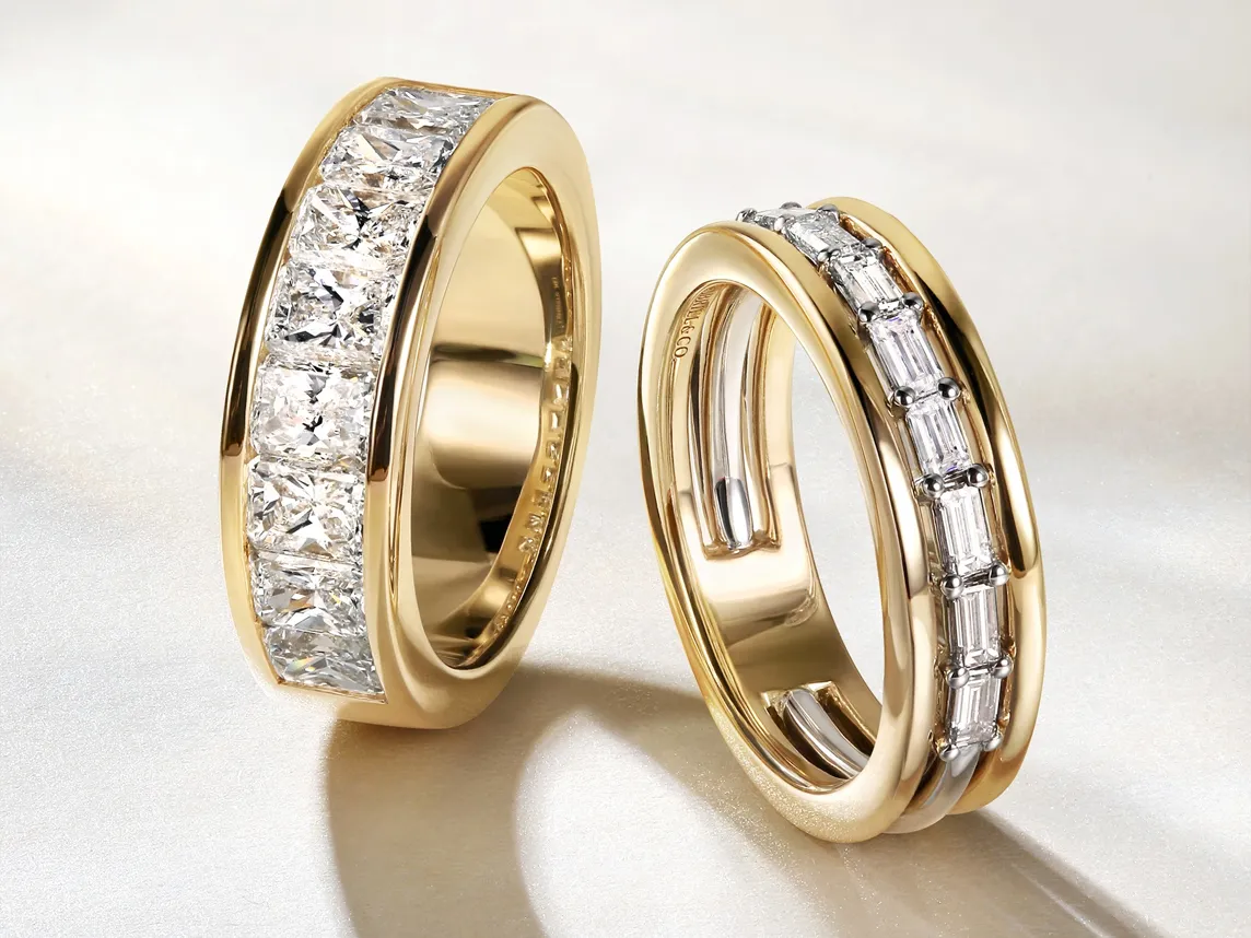Two elegant gold rings with diamond accents, showcasing a modern design. Visit Bryan Jewelry in Prattville for more.