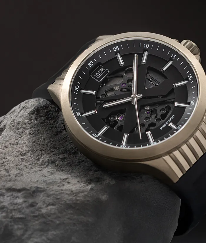 Glock watch on a stone, showcasing rugged design. Click to Shop Now at Bryan Jewelry in Prattville.