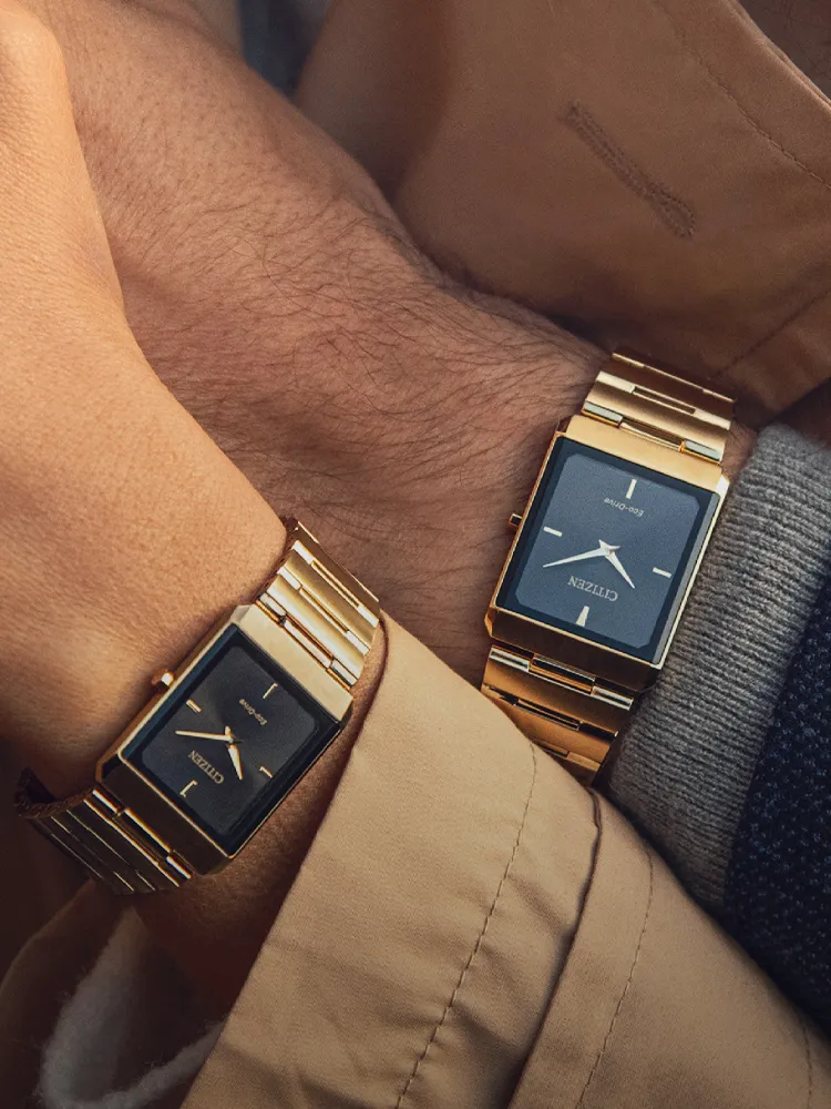 Two gold Citizen watches on wrists, showcasing luxury timepieces. Visit Bryan Jewelry for fine jewelry in Prattville.