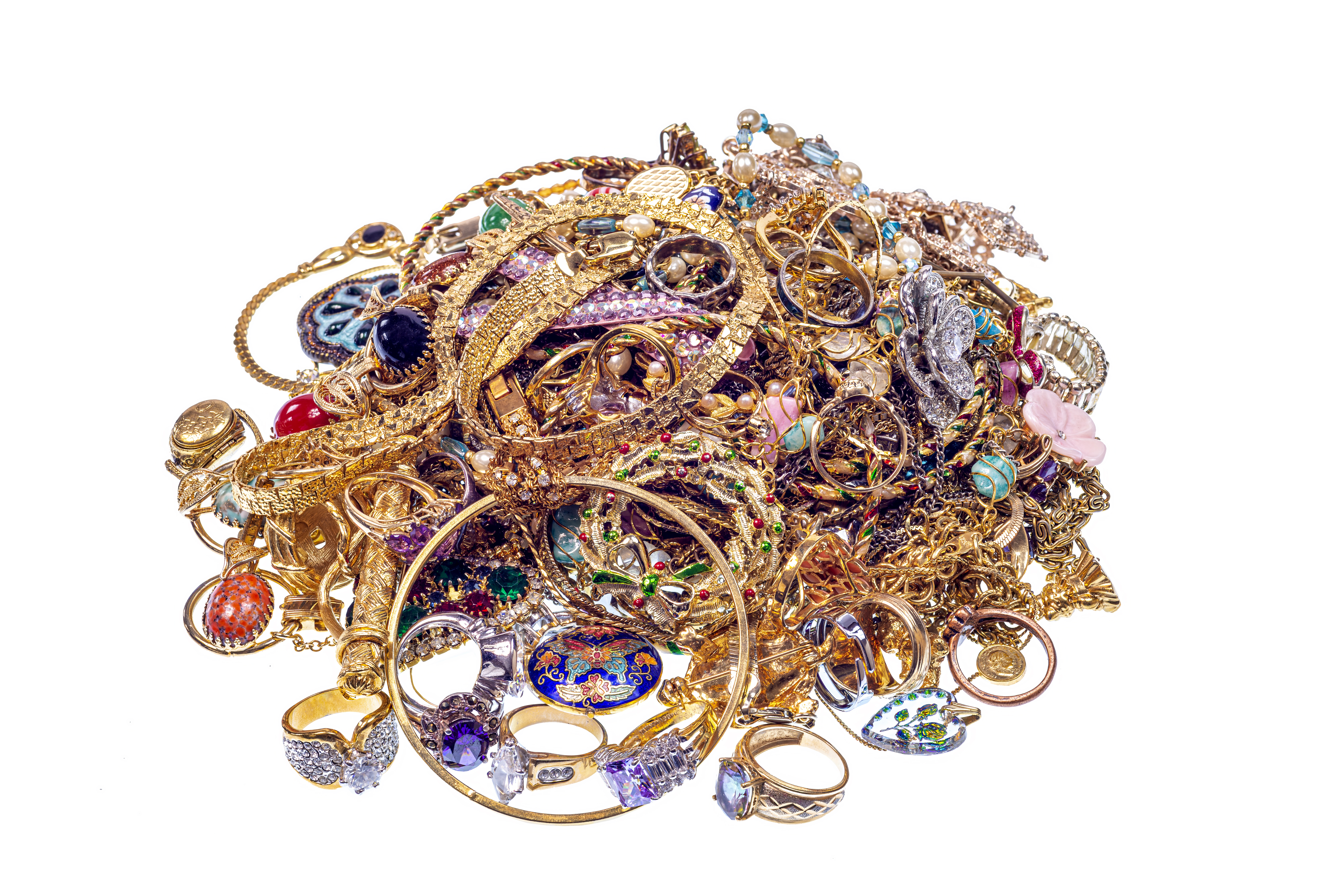 A pile of various fine gold jewelry with a white background, with different colored gems and stones