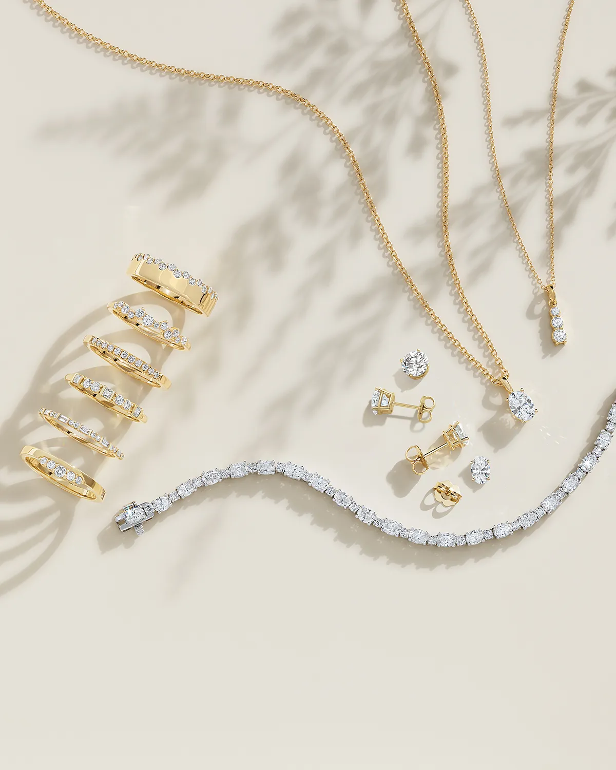 Elegant gold and diamond jewelry set on a light background. Shop now at Canton Jewelry.