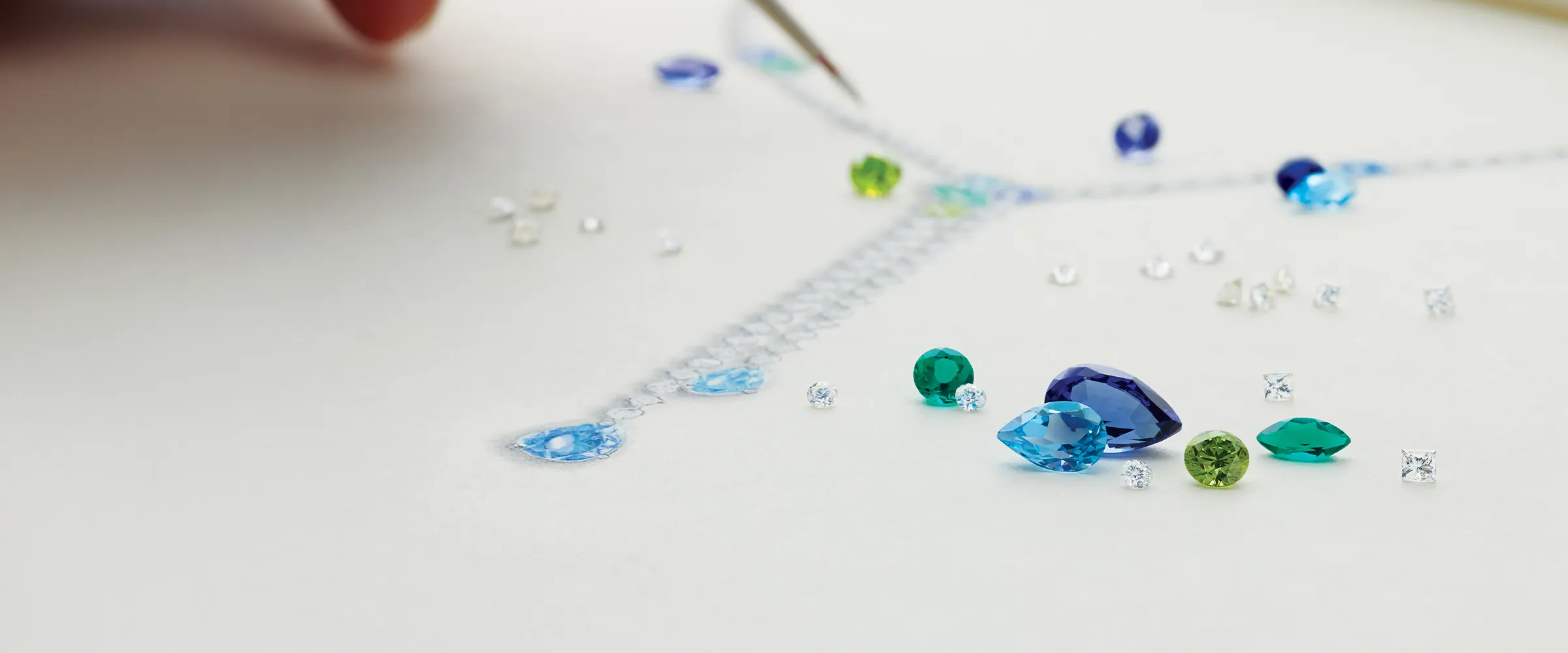 Custom gemstone jewelry design process with loose gems at Canton Jewelry.