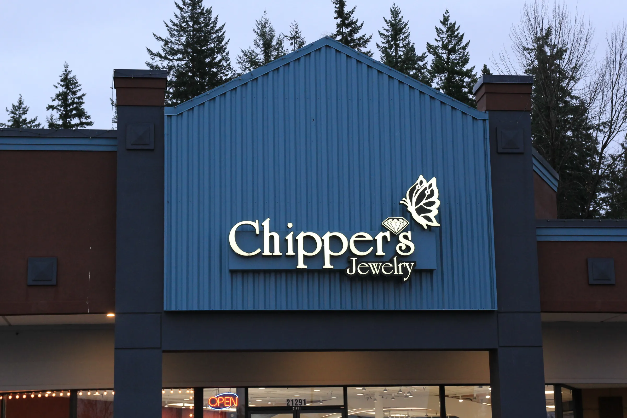 Chipper's Jewelry storefront in Bonney Lake, WA, featuring a sign with a butterfly and diamond design.