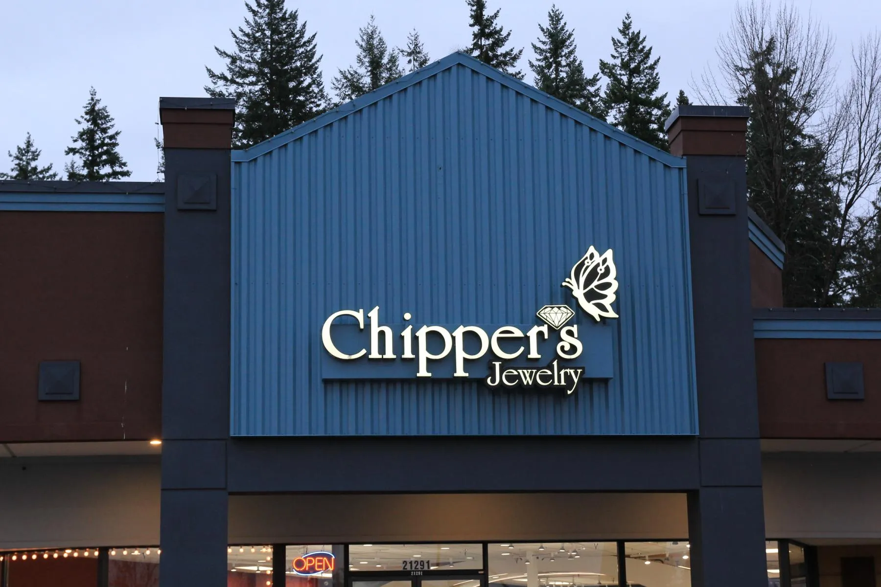 Chipper's Jewelry storefront in Bonney Lake, featuring a sign with a butterfly and diamond design.