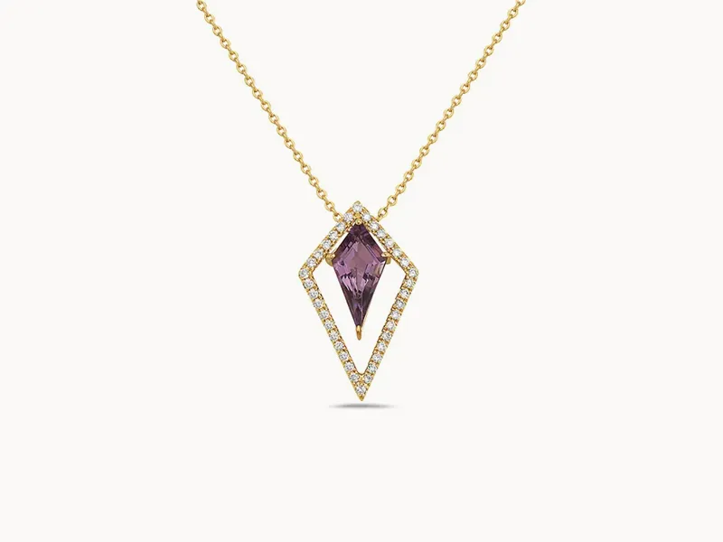 A gold necklace with a purple gemstone pendant set in a diamond-studded geometric frame.