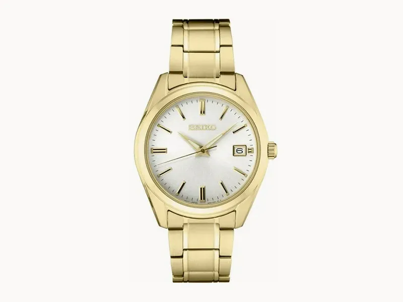 Gold wristwatch with a white dial, gold markers, and date display on a gold bracelet.
