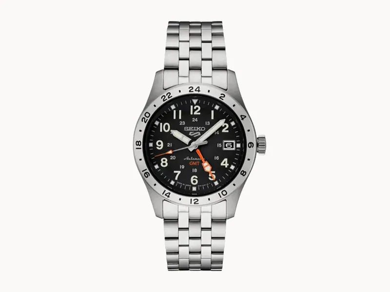 Stainless steel watch with black dial, silver markers, and orange GMT hand.