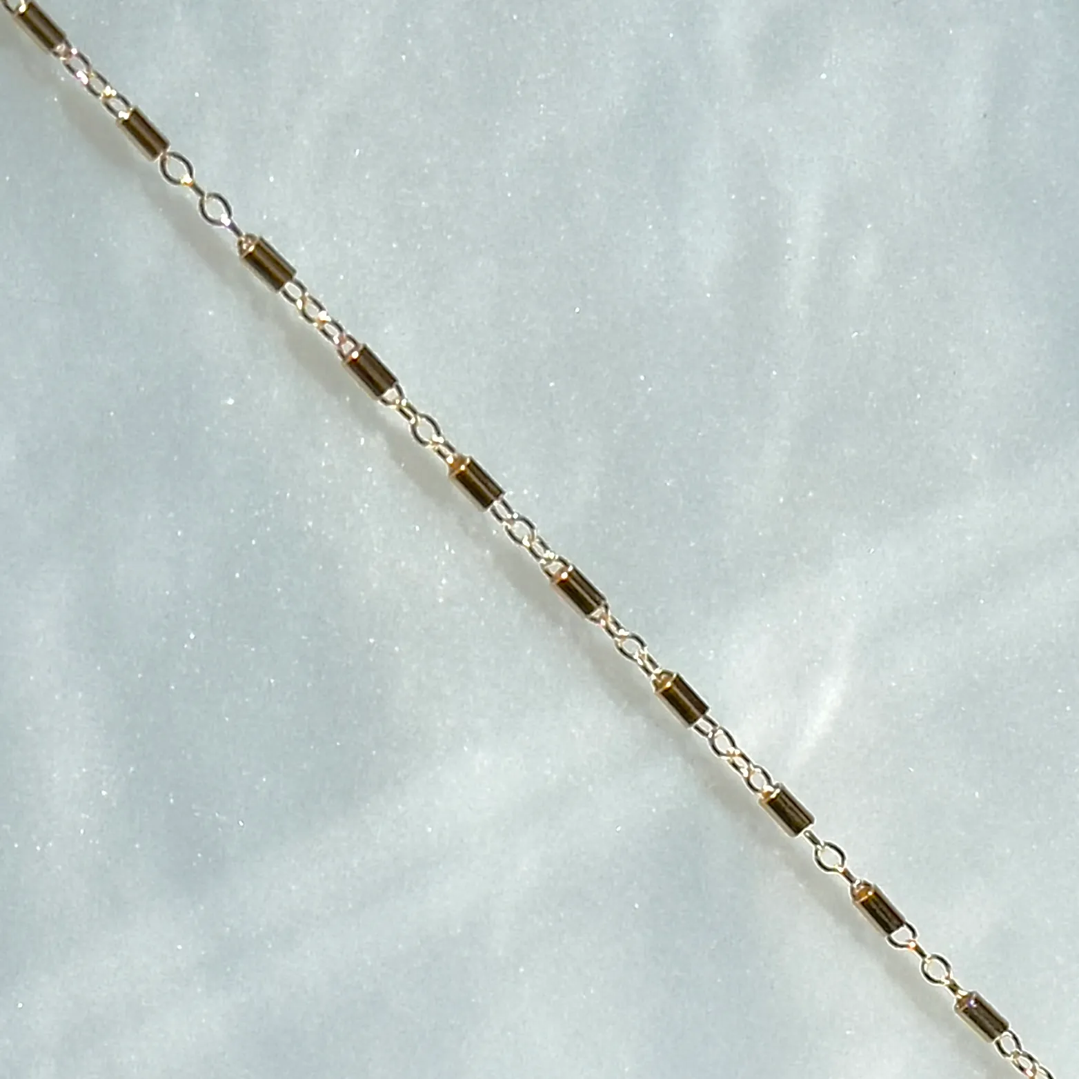  14K YELLOW GOLD FILLSATELLITE BARCABLE CHAIN$5.00 per inch Conti Jewelers Endwell, NY