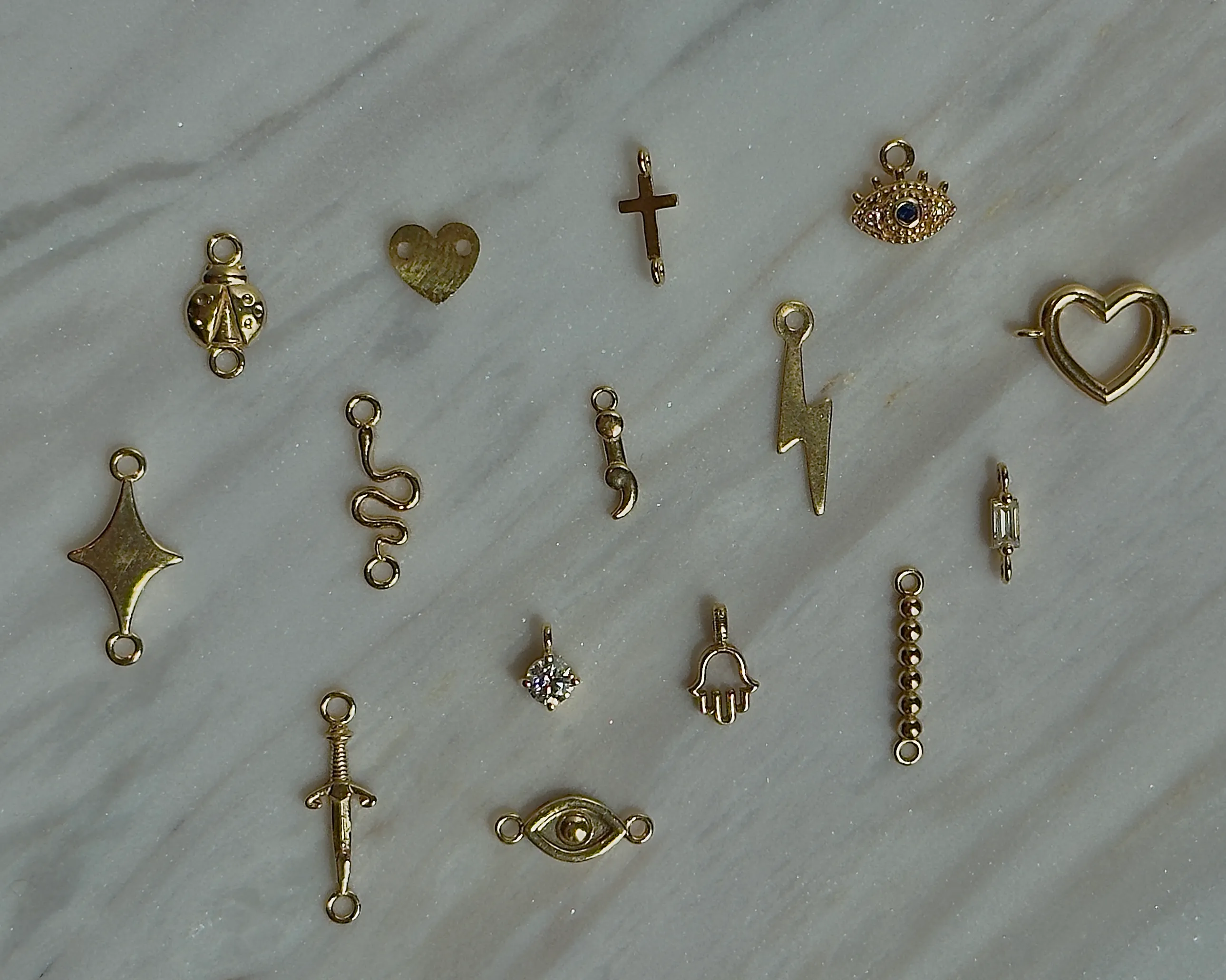 Gold charms  Conti Jewelers Endwell, NY